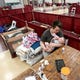 Izaiah Marquez feeds daughter Ruby, 6 mos., in the family's sectioned off area at the Kitsap Rescue Mission Shelter located in the Kitsap Sun Pavilion on Tuesday, March 31, 2020. 