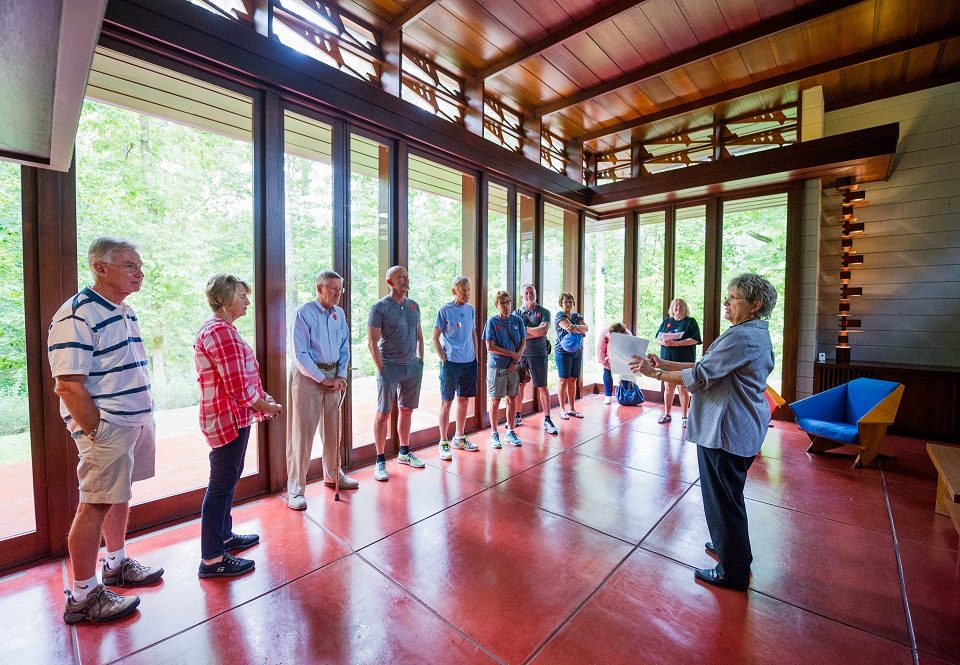 Crystal Bridges volunteer Mary Myers leads an architecture tour in the Bachman-Wilson House.
