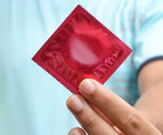 holding condom