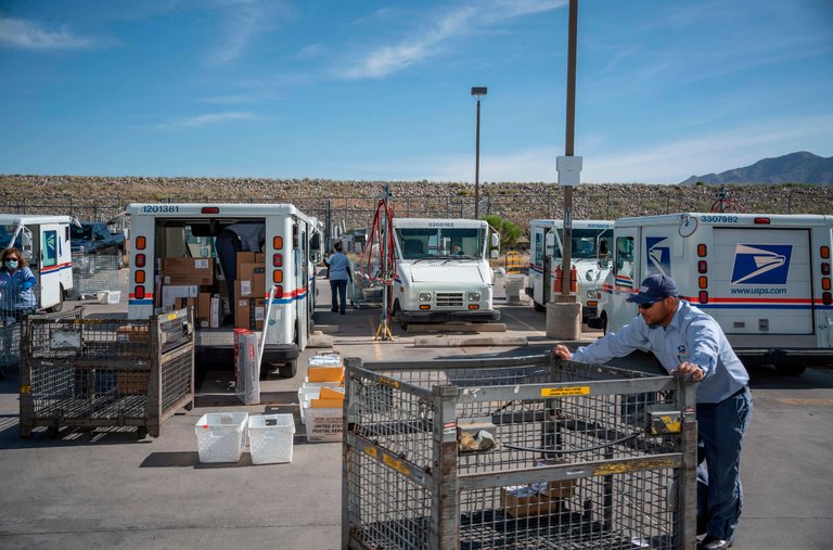 Mail carriers at a Postal Service sorting facility in El Paso last month. 