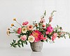 A Native Poppy arrangement is pictured in an un...
