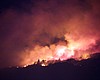 Flames from the Witch Creek fire light up the e...