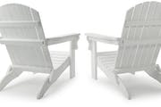 Two white Adirondack chairs