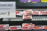 A sign at a Kroger store in Atlanta limits shoppers to three packages of ground beef on Tuesday, May 5, 2020. Kroger is limiting meat purchases, like 