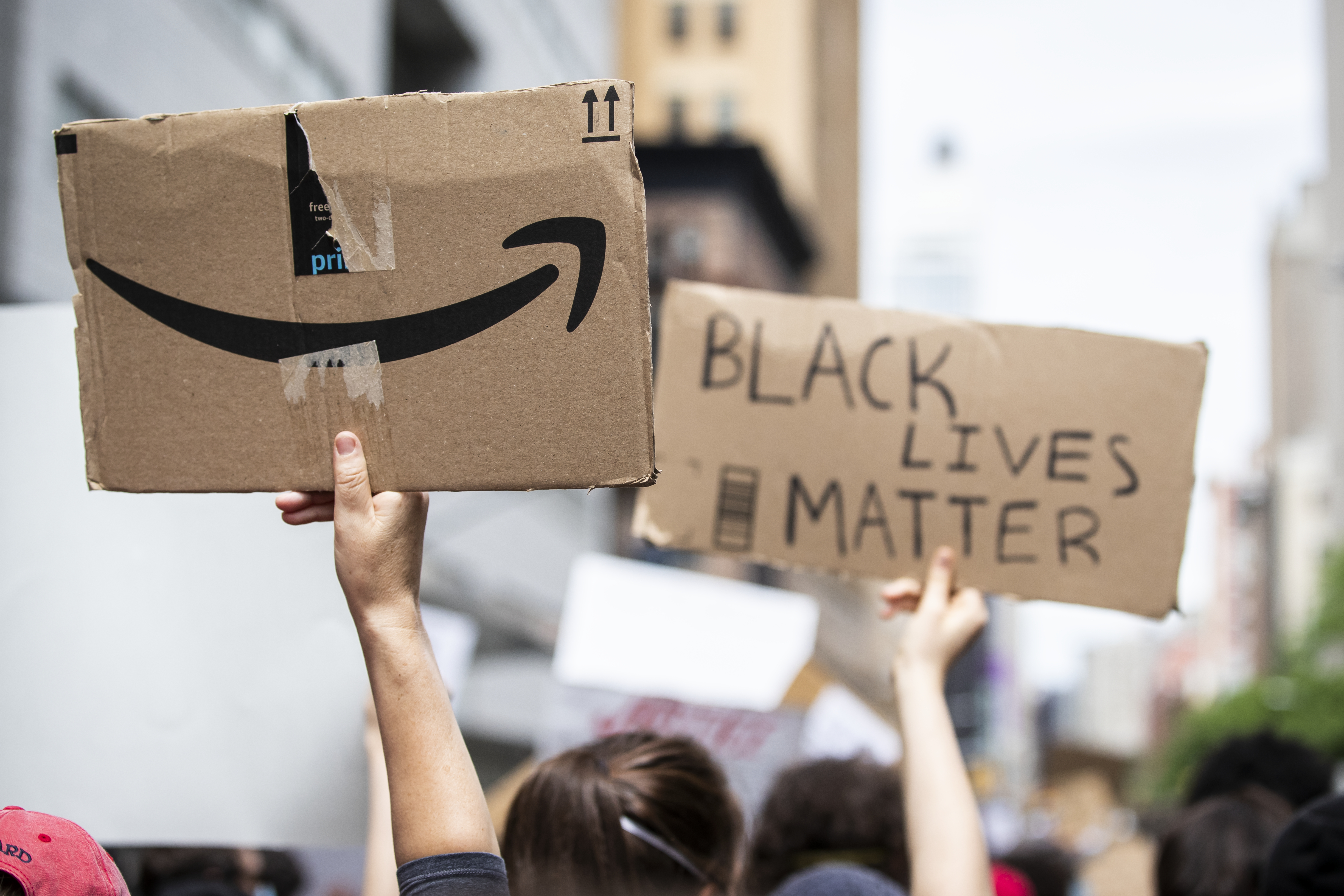 An Amazon logo on the back of a Black Lives Matter protest sign.