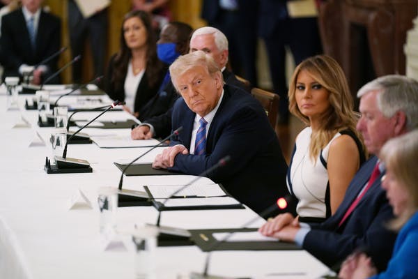 President Donald Trump and first lady Melania Trump at a discussion, that also included Education Secretary Betsy DeVos, about safely reopening Americ