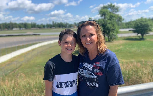 Kristi Copham, the owner of Brainerd International Raceway, with her son Ayden at the track.