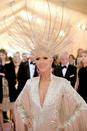 Celine Dion channeled her inner Vegas showgirl with this feathered headpiece at the 2019 Met Gala.