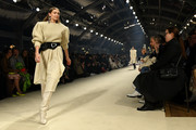 Gigi Hadid wore an oversized beige sweater at the Isabel Marant Fall 2020 show.