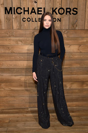 Ashley Benson kept it simple up top in a black Michael Kors turtleneck during the brand's Fall 2020 show.