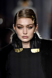 Gigi Hadid adorned her 'do with a gold hair pin.