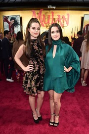 Laura Marano opted for an emerald-green keyhole-cutout dress with flowy sleeves.