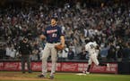 Twin reliever Tyler Duffey reacted after New York Yankees shortstop Didi Gregorius, rear, knocked a grand slam home run in the third inning.