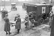 Members of the American Red Cross remove Spanish influenza victims from a house in St. Louis in 1918.