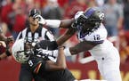 Iowa State wide receiver Joseph Scates, left, fights with TCU cornerback Jeff Gladney (12) during the second half of an NCAA college football game, Sa