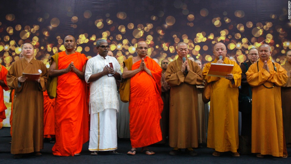 Buddhist monks at Kuala Lumpur International Airport offer a special prayer for the missing passengers on March 9, 2014.