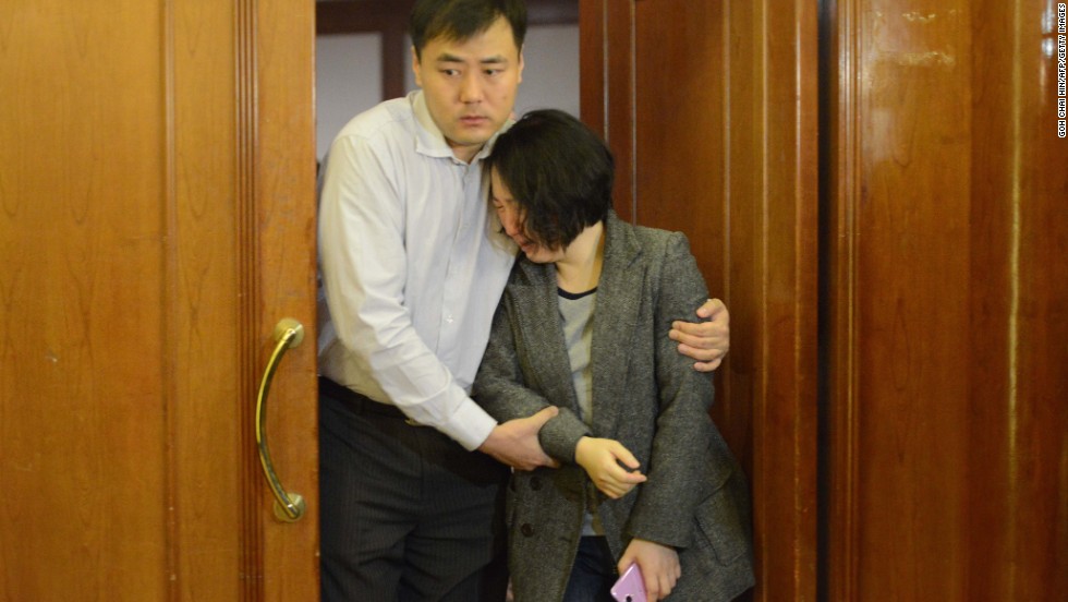 Grieving relatives of missing passengers leave a hotel in Beijing on March 24, 2014.