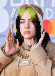 Billie Eilish accessorized with a sun visor by Burberry at the 2020 BRIT Awards.