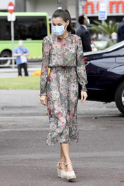 Queen Letizia of Spain paired cream espadrille wedges by Macarena with a lovely floral frock for her tour of Bilbao.