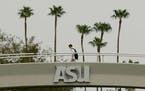 A students walks to class on the campus of Arizona State University Tuesday, July 10, 2007 in Tempe, Ariz. Instagram has deleted an account that claim