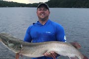Corey Kitzmann of Davenport, Iowa, owns the new Minnesota muskie release record. He caught this 57¼ inch fish while on Lake Vermilion on Aug. 6, 2019