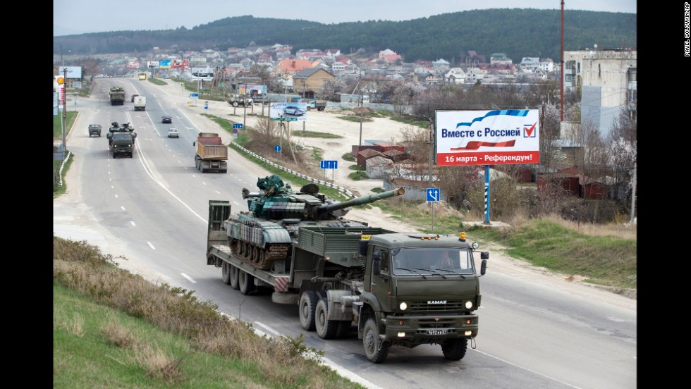 Ukrainian tanks are transported from their base in Perevalne, Crimea, on Wednesday, March 26. After Russian troops seized most of Ukraine&#39;s bases in Crimea, interim Ukrainian President Oleksandr Turchynov ordered the withdrawal of armed forces from the Black Sea peninsula, citing Russian threats to the lives of military staff and their families.