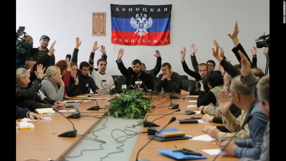Members of the self-proclaimed government the &quot;Donetsk Republic&quot; vote April 10 during a meeting at the seized regional administration building in Donetsk.