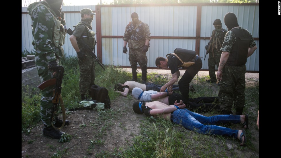 Pro-Russian militants detain three men on Sunday, May 18, in Kramatorsk, Ukraine. The men are suspected of spying for the Ukrainian government.