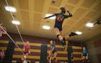 Jordan Mitchell jumped up for a spike during Denfeld High School volleyball practice on Tuesday.