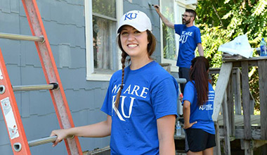 Students repainting homes in the community