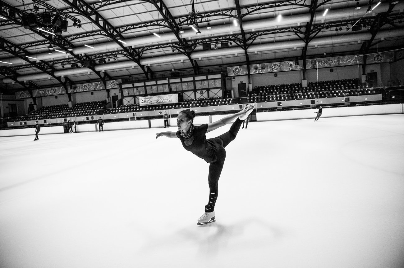 woman ice skating in a rink
