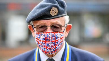Ex RAF serviceman Tom Blundell wears a Union flag mask