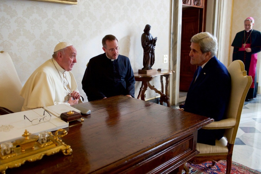 Secretary Kerry sits with Pope Francis and his translator on December 2, 2016, before a one-on-one meeting in the Papal Apartments at the Vatican in Vatican City.