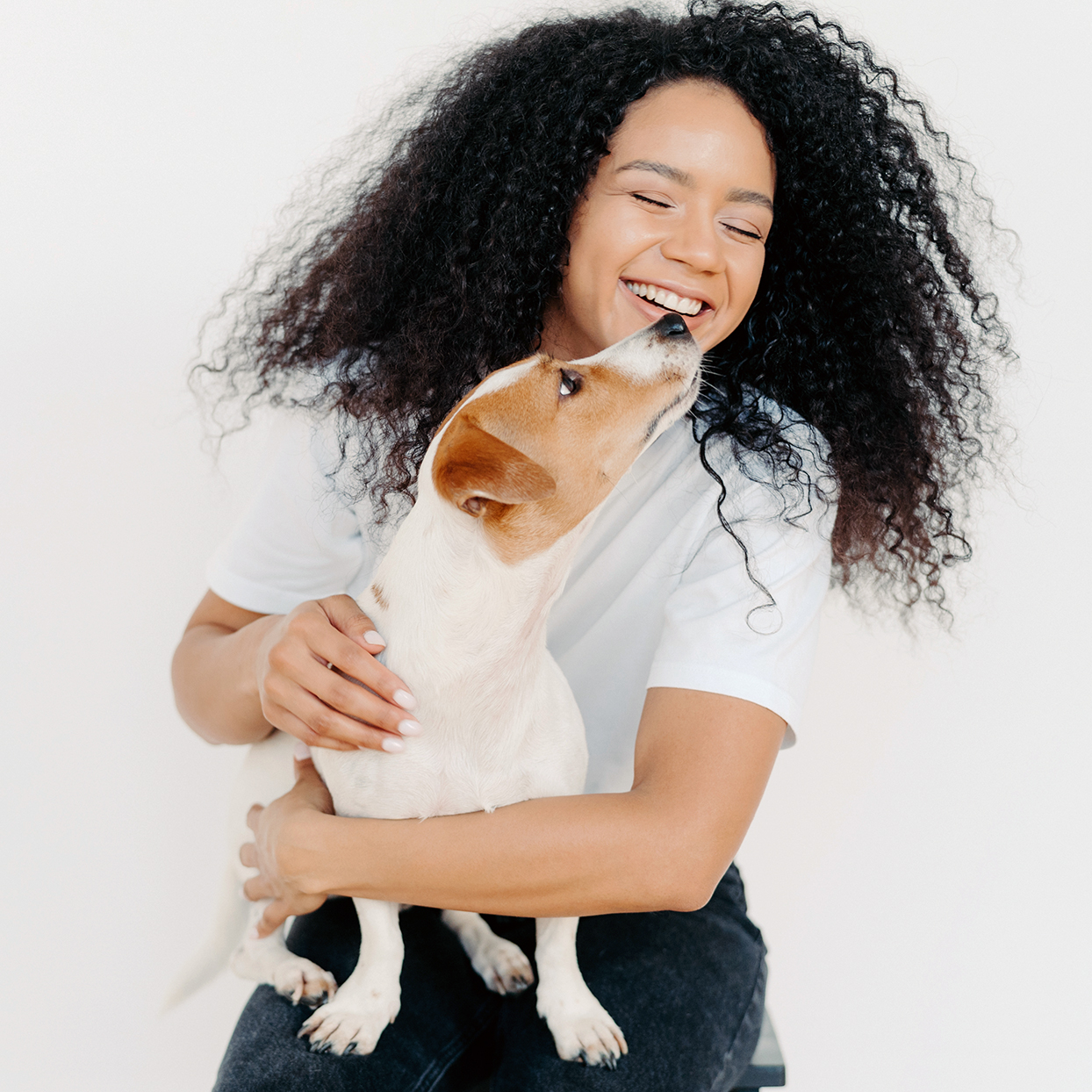 Woman laughing with dog