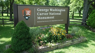 Entrance signs that reads George Washington Carver National Monument