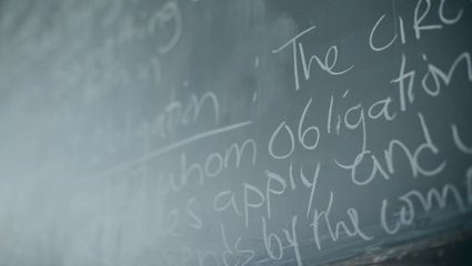 Universe of Obligation definition on a classroom chalkboard.
