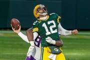 Aaron Rodgers fumbles as he is hit by Minnesota Vikings' rookie D.J. Wonnum on the final play of the game.