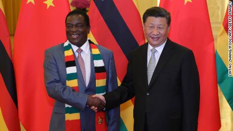Chinese President Xi Jinping (R) shakes hands with Zimbabwe&#39;s President Emmerson Mnangagwa at a meeting at the Great Hall of the People in Beijing on September 5, 2018, a day after the conclusion of the Forum On China-Africa Cooperation. (Photo by Lintao Zhang / POOL / AFP)        (Photo credit should read LINTAO ZHANG/AFP via Getty Images)