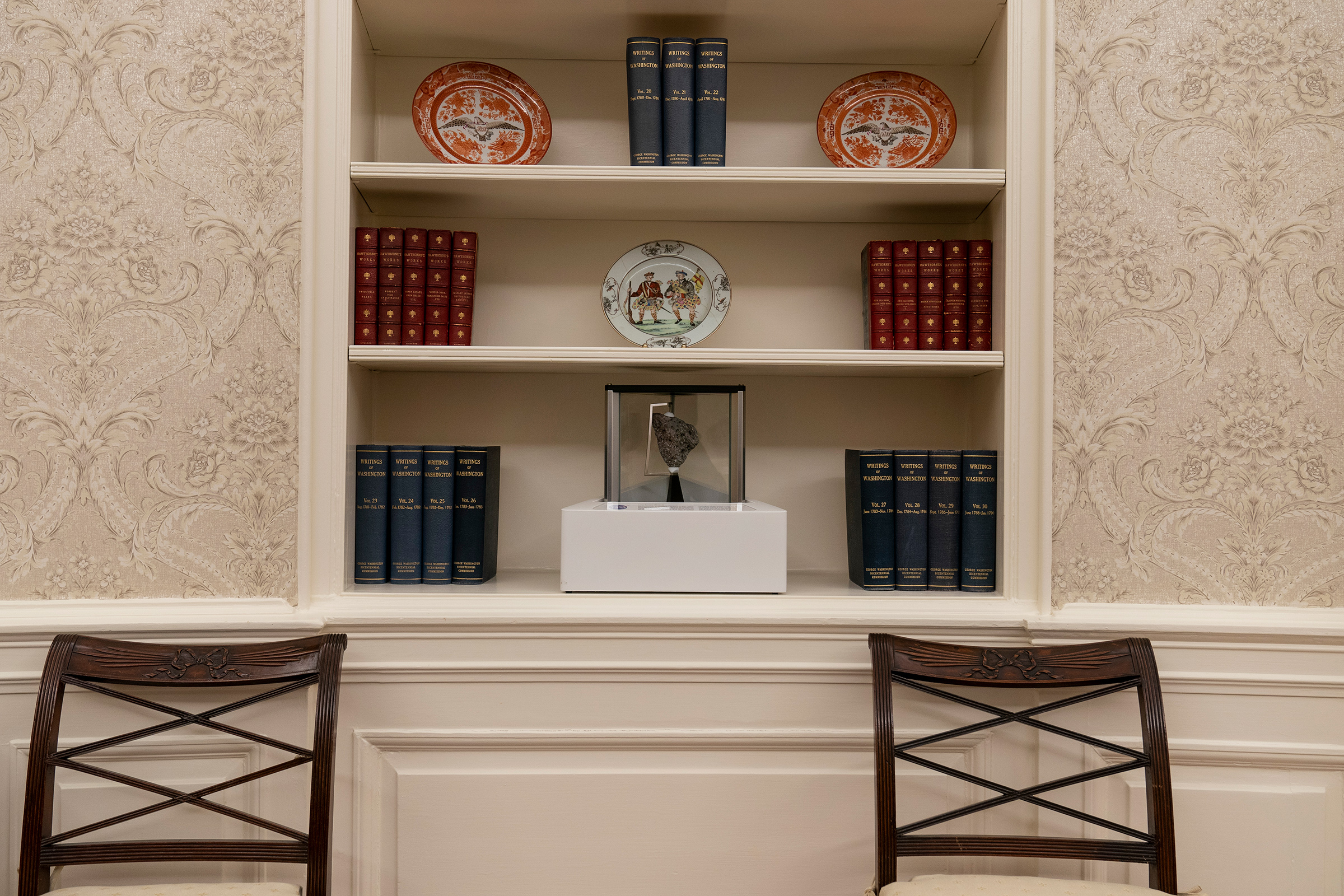 President Joe Biden's redecoration of the Oval Office of the White House includes a rock from the moon, shown here on the bottom shelf on Jan. 20, 2021.