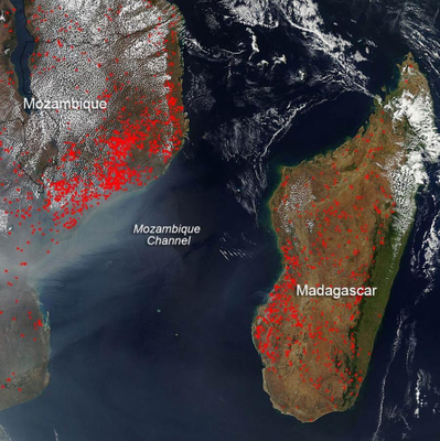 The location, widespread nature, and number of fires (outlined in red) in this satellite image suggest that these blazes were deliberately set to manage land. Farmers often use fire to return nutrients to the soil and to clear the ground of unwanted plants. While fire helps enhance crops and grasses for pasture, the fires also produce smoke that degrades air quality. In Mozambique and Madagascar, the growing season runs from the first rains in October-November. Thus, the clearing of lands in this early September image heralds the new growing season. Much of the once-green isle of Madagascar has been deforested via a combination of slash and burn agriculture for rice cultivation and doro-tanetry, a less intensive burning used to augment grass growth for cattle grazing. The fires mostly burn in grass or cropland, which is tan in this image. Photo courtesy of NASA.