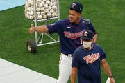 Wes Johnson — here with All-Star Jose Berrios at Target Field last month — was a surprise hire as Twins pitching coach but has delivered results i