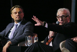 Film star Leonardo DiCaprio, left, and director Martin Scorsese speaks during a news conference in Macau, Tuesday, Oct. 27, 2015. (AP Photo/Kin Cheung)