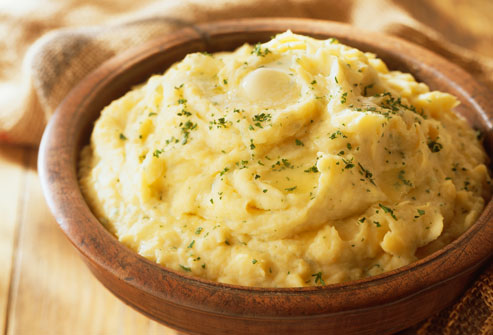 Bowl of Mashed Potatoes with Butter and Parsley