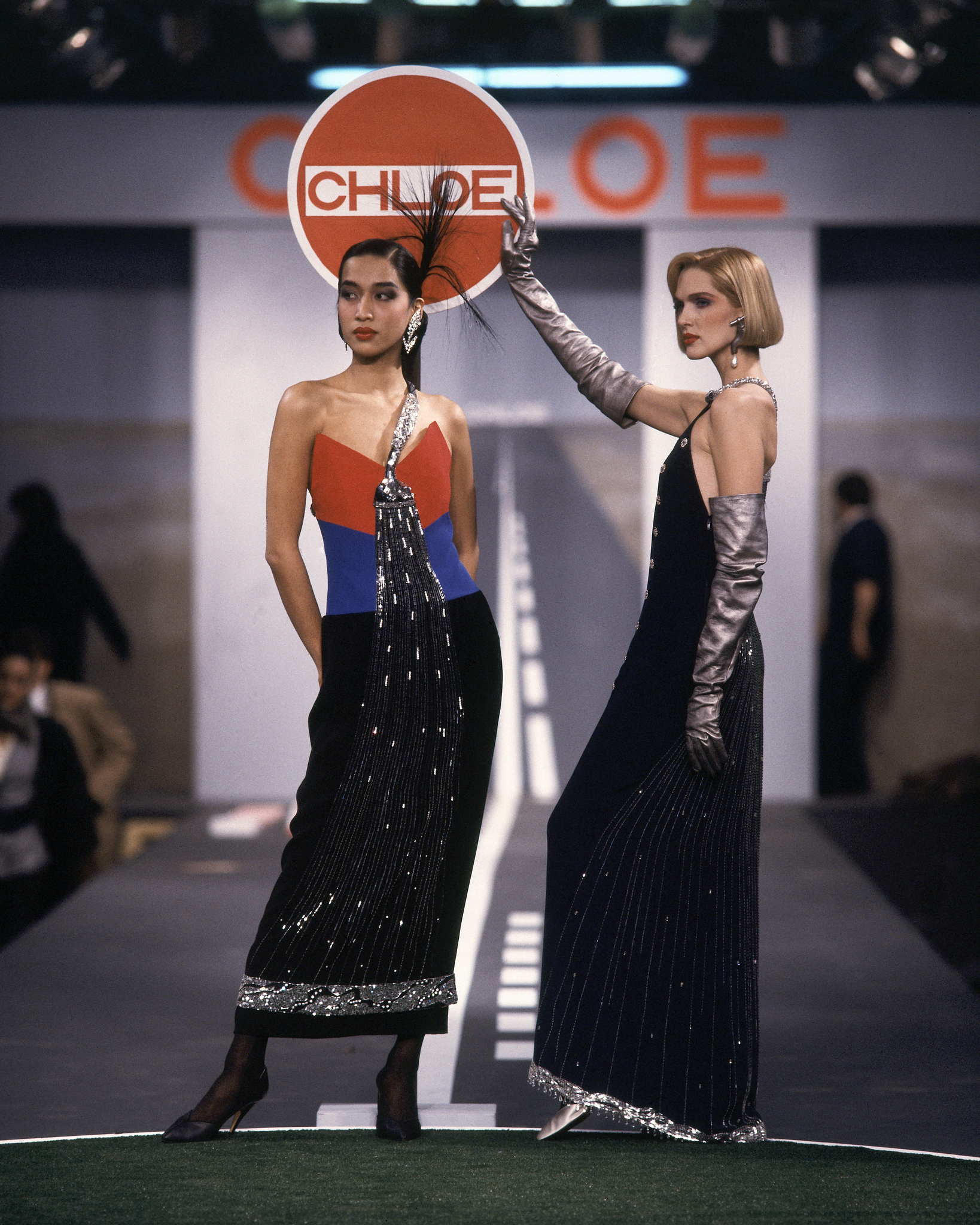 Models wearing splashy beaded faucet dreses in silk crepe on the runway of Karl Lagerfeld's Fall 1983 Ready-To-Wear collection for Chloe on March 21, 1983 in Paris, France.