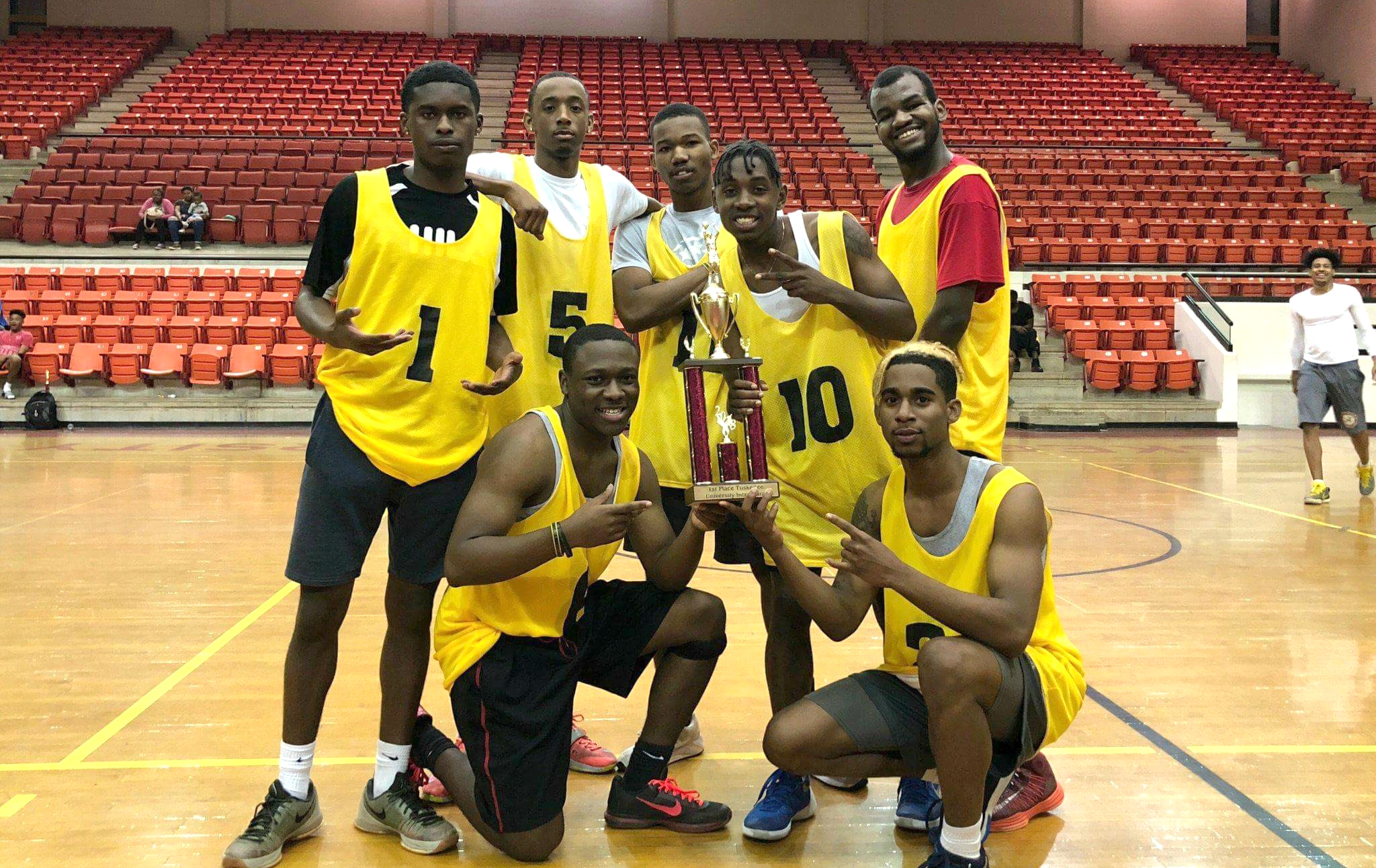 Intramural 5 on 5 basketball champs with trophy
