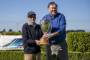 Winning owner Chris Alcock, left, is presented the Northern Southland Cup by race sponsor Dave McHugh, of the Yaldhurst ...