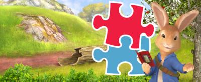 Peter Rabbit with blue and red jigsaw pieces. 