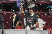 Tampa Bay Buccaneers quarterback Tom Brady holds the Vince Lombardi Trophy after winning Super Bowl LV 