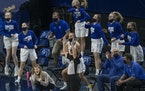 BBE’s Head Coach Kristina Anderson, center, and the bench reacted to a three-point shot during the second half of the game, Tuesday, April 6, 2021 i