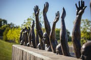 "Raise Up," a sculpture by Hank Willis Thomas, on the grounds of the new National Memorial for Peace and Justice in Montgomery, Ala., April 20, 2018.